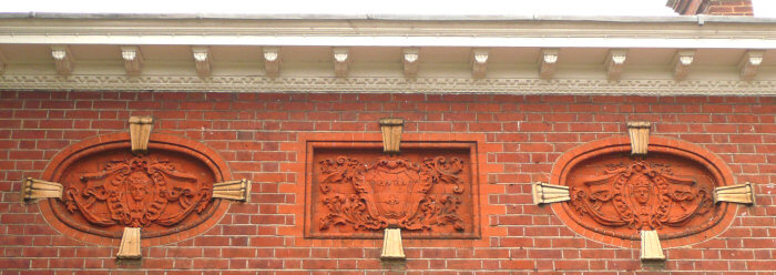 Terracotta inlays on the rear face of the house.